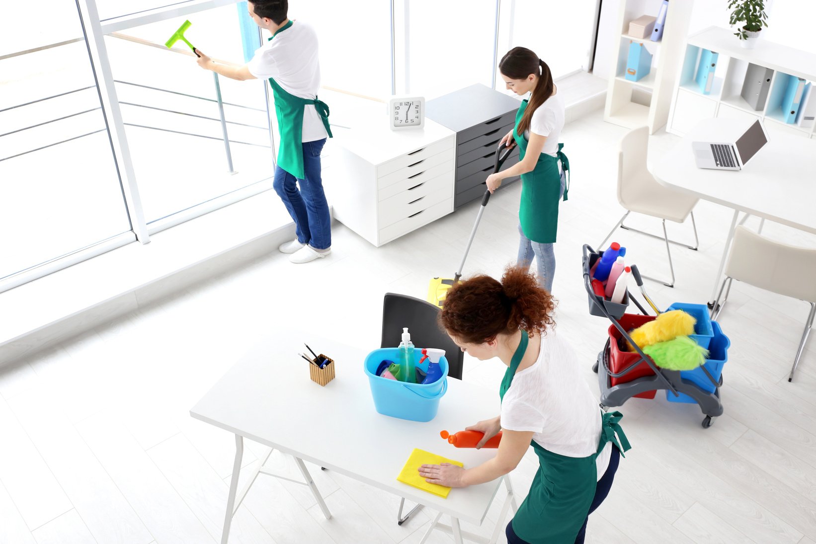 A Cleaning Service Team Cleaning an Office
